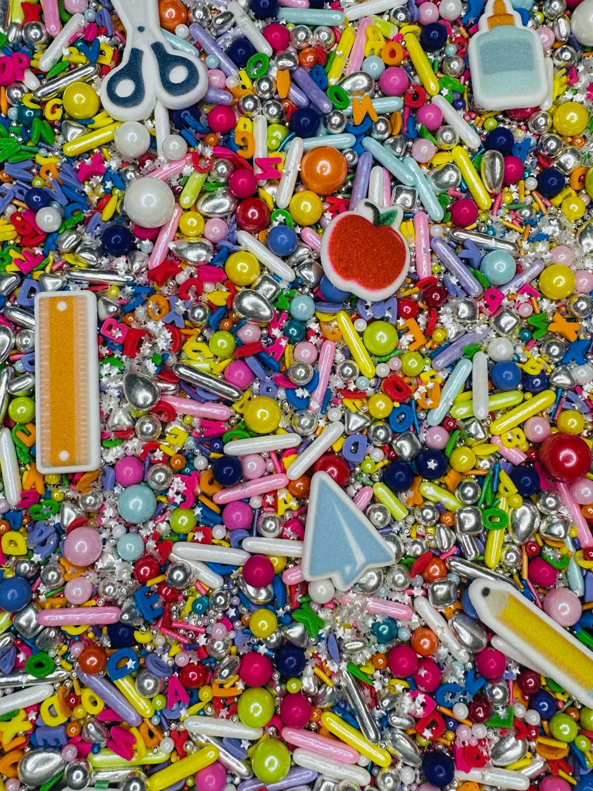 Sprinkles dia del maestro con figuras icing